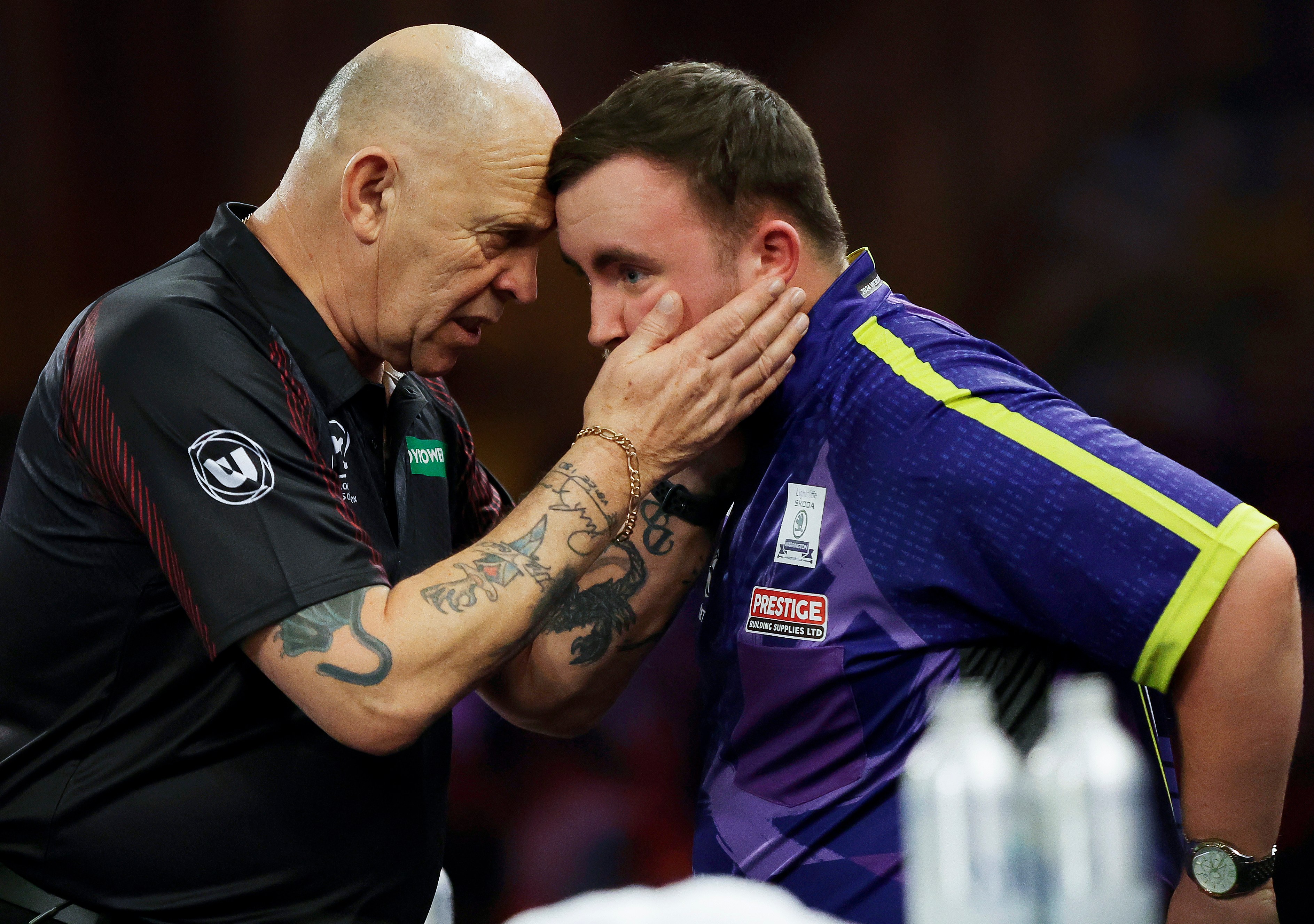 Russ Bray speaking with Luke Littler at the PDC World Darts Championship final.